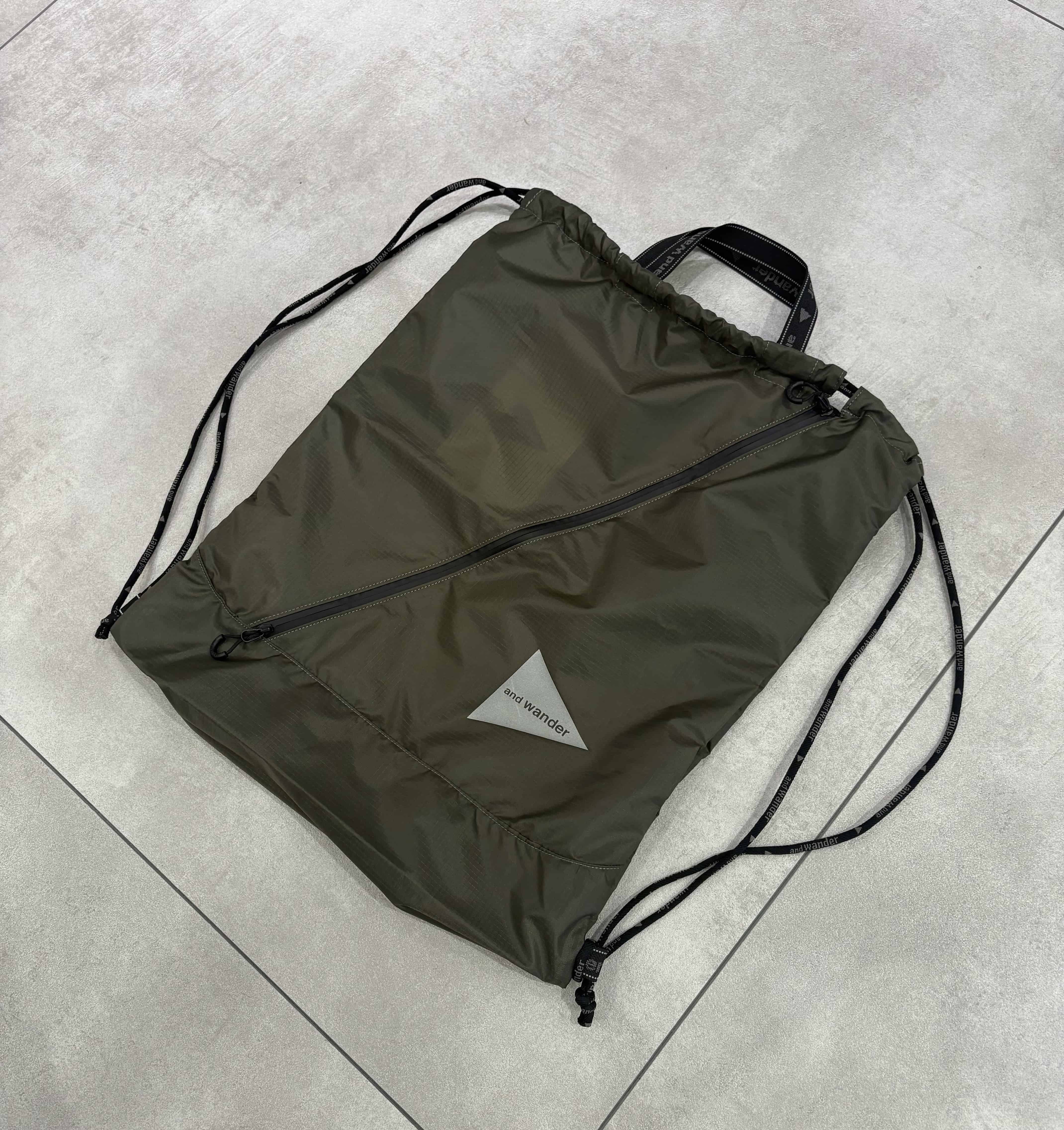 and wander/アンドワンダー/crispy rip drawstrung bag ドローストリングバッグ KHAKI FREE