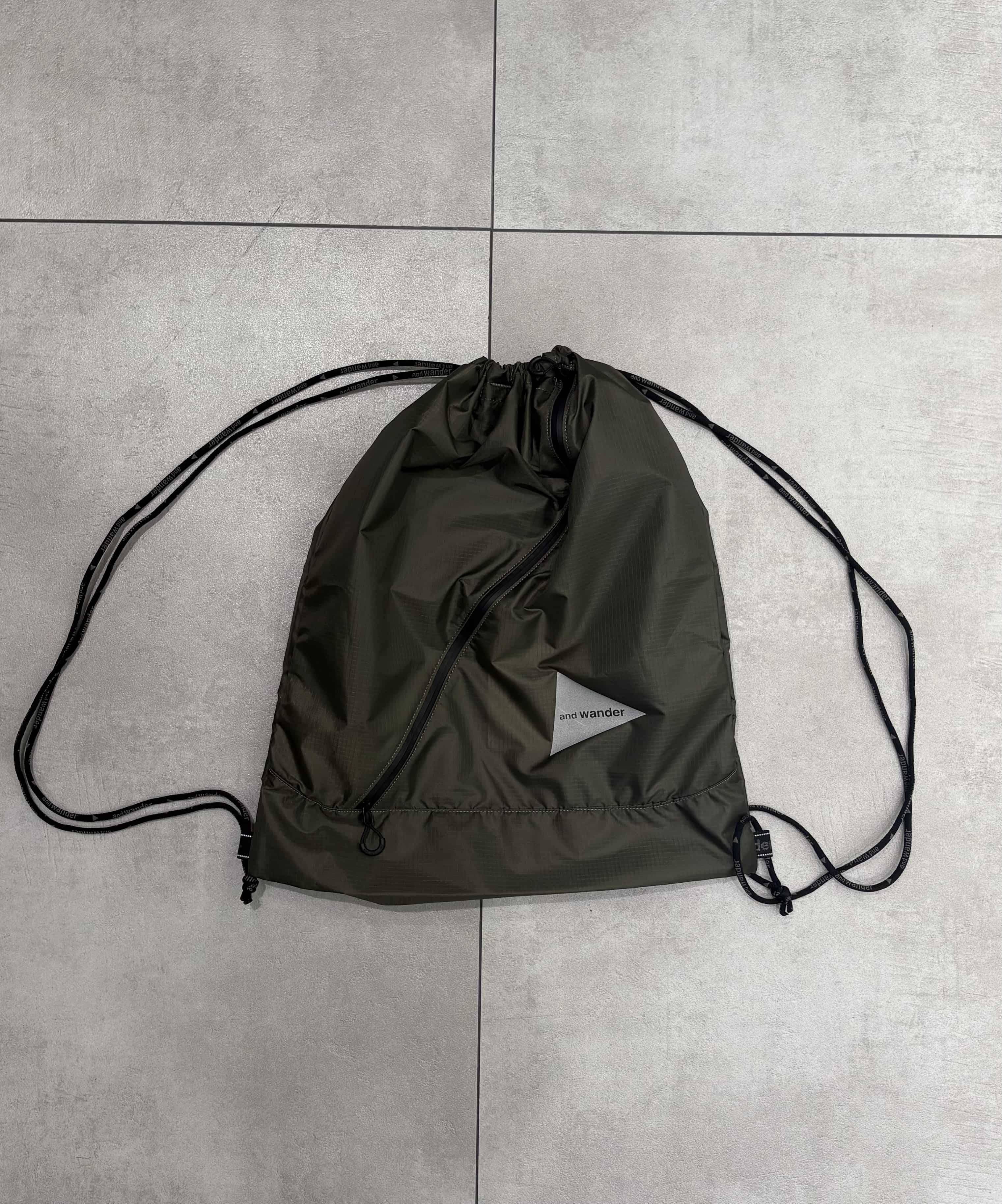 and wander/アンドワンダー/crispy rip drawstrung bag ドローストリングバッグ KHAKI FREE